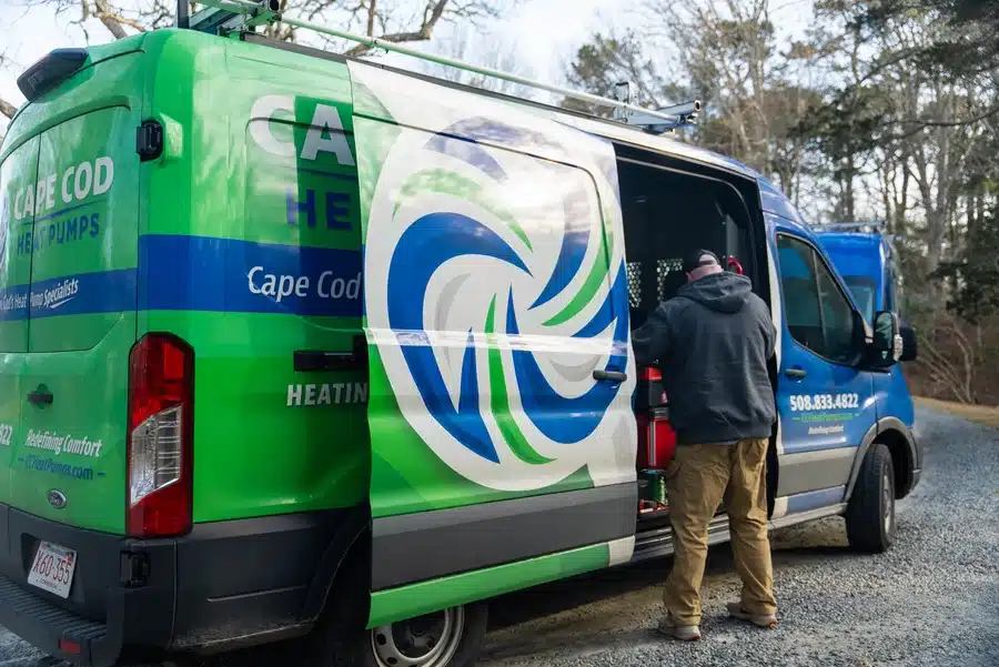 Technician in front of Cape Heating AC & Electric van on Cape Cod, MA.
