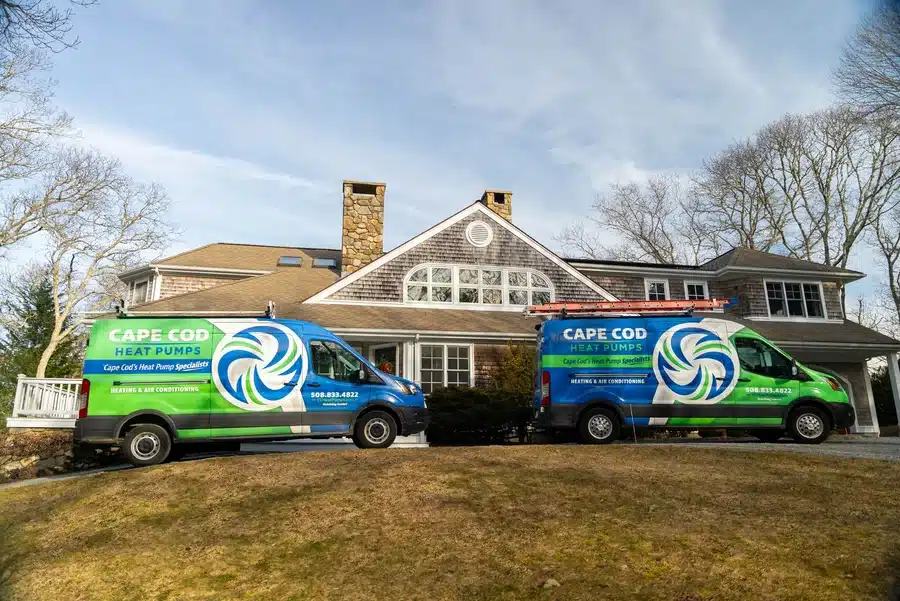 Cape Heating AC & Electric Vans outside of residential home on Cape Cod, MA.
