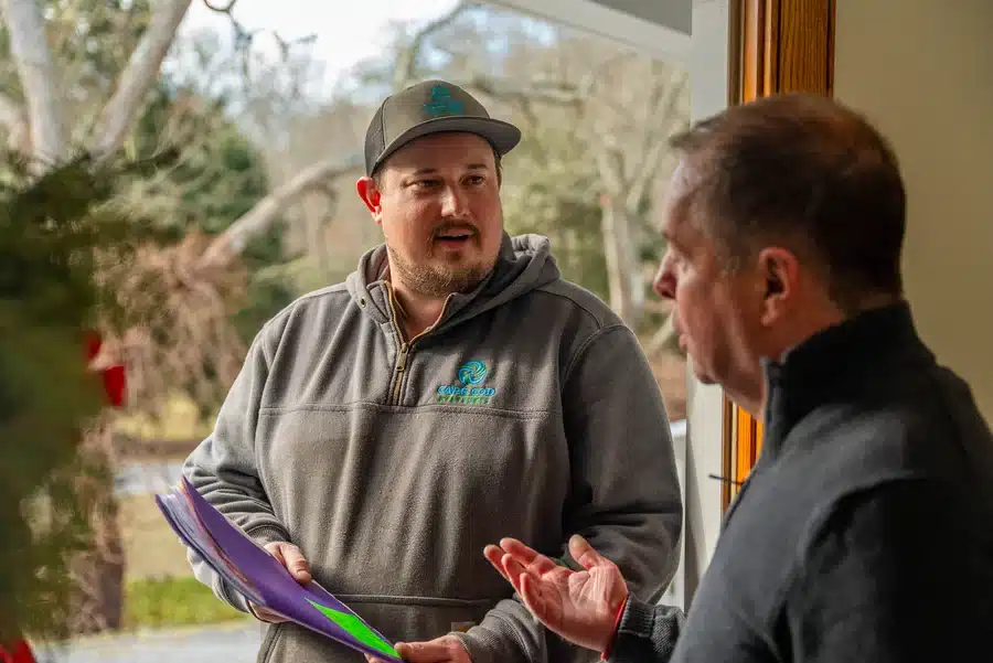 Technician helping homeowner on Cape Cod, MA.