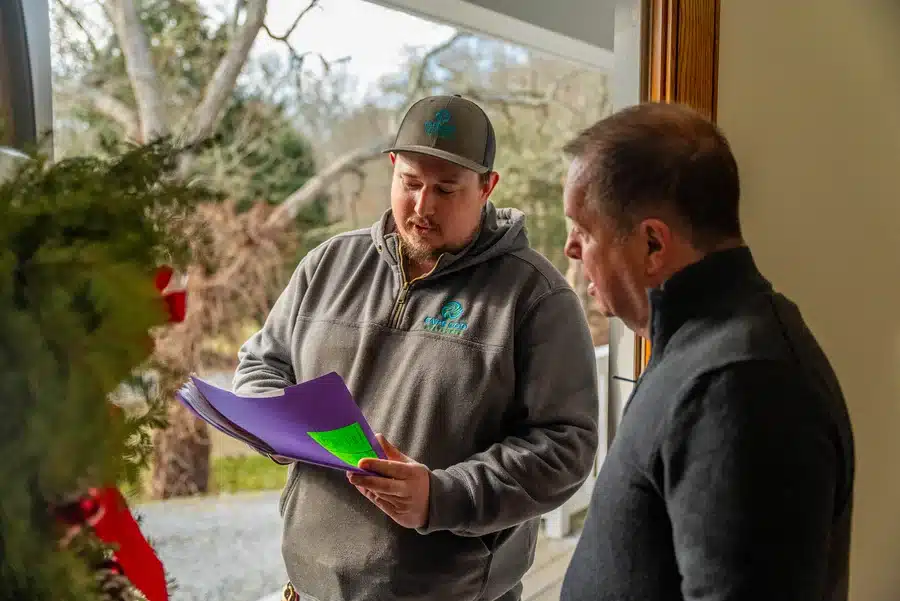 Technician helping homeowner on Cape Cod, MA.
