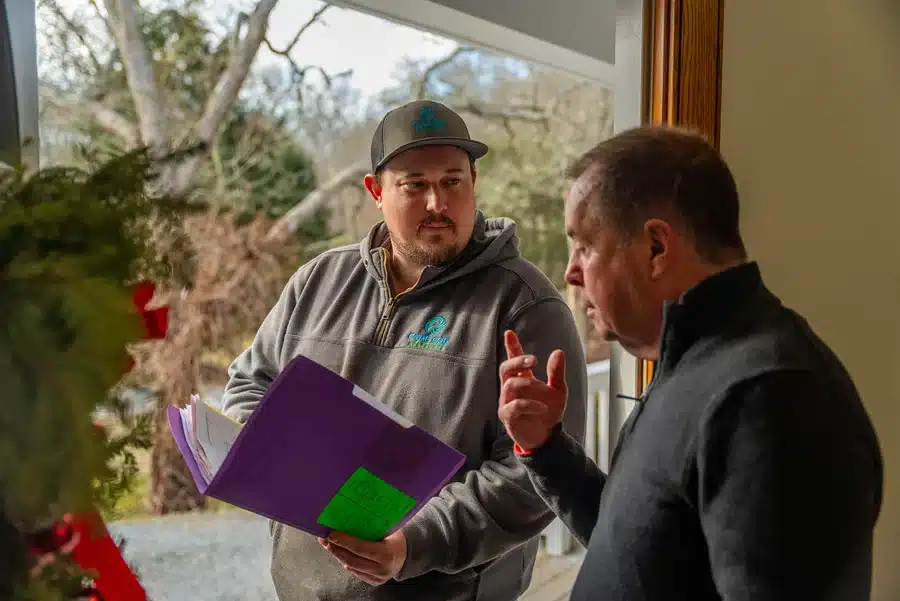 Technician helping homeowner on Cape Cod, MA.