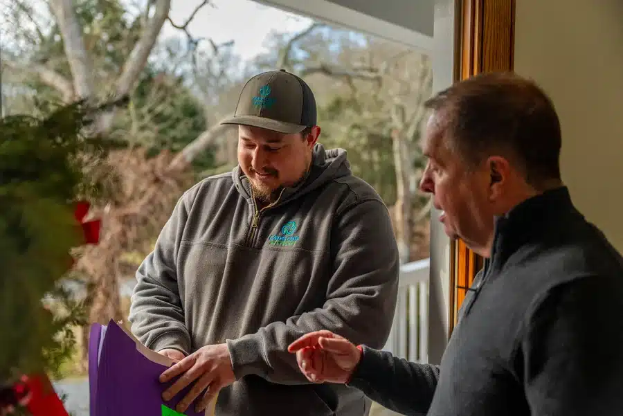 Technician helping homeowner on Cape Cod, MA.