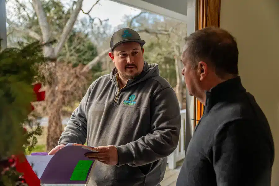 Technician helping homeowner on Cape Cod, MA.