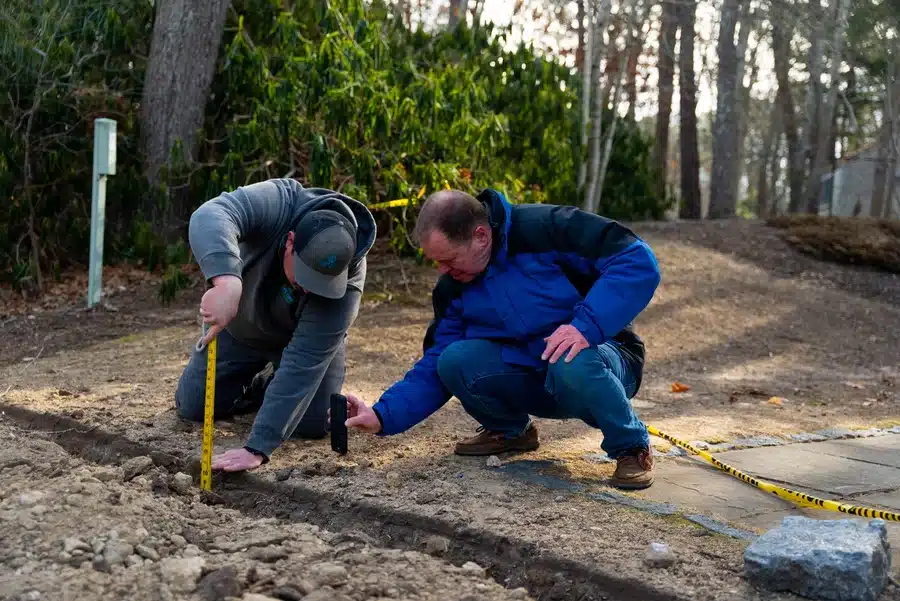 Cape Heating AC & Electric technicians working on electrical line on Cape Cod, MA.